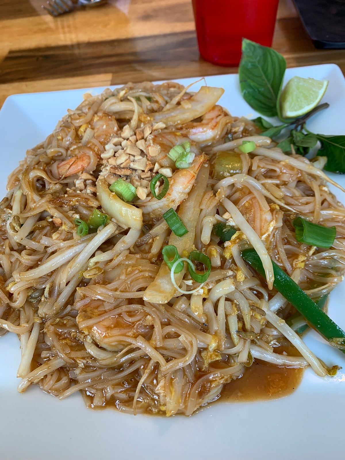 Pad Thai with peanuts, lime, bean sprouts and green onion